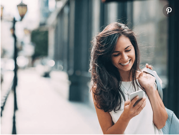 Girl very happy looking at phone